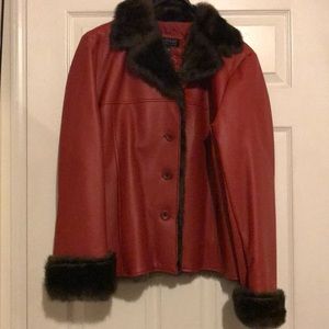 Faux leather jacket with faux mink trim. Lined.